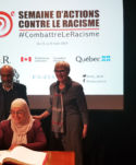 Samira Haouni, coordonnatrice de la SACR, assise, Frantz Voltaire président de la semaine, au milieu.